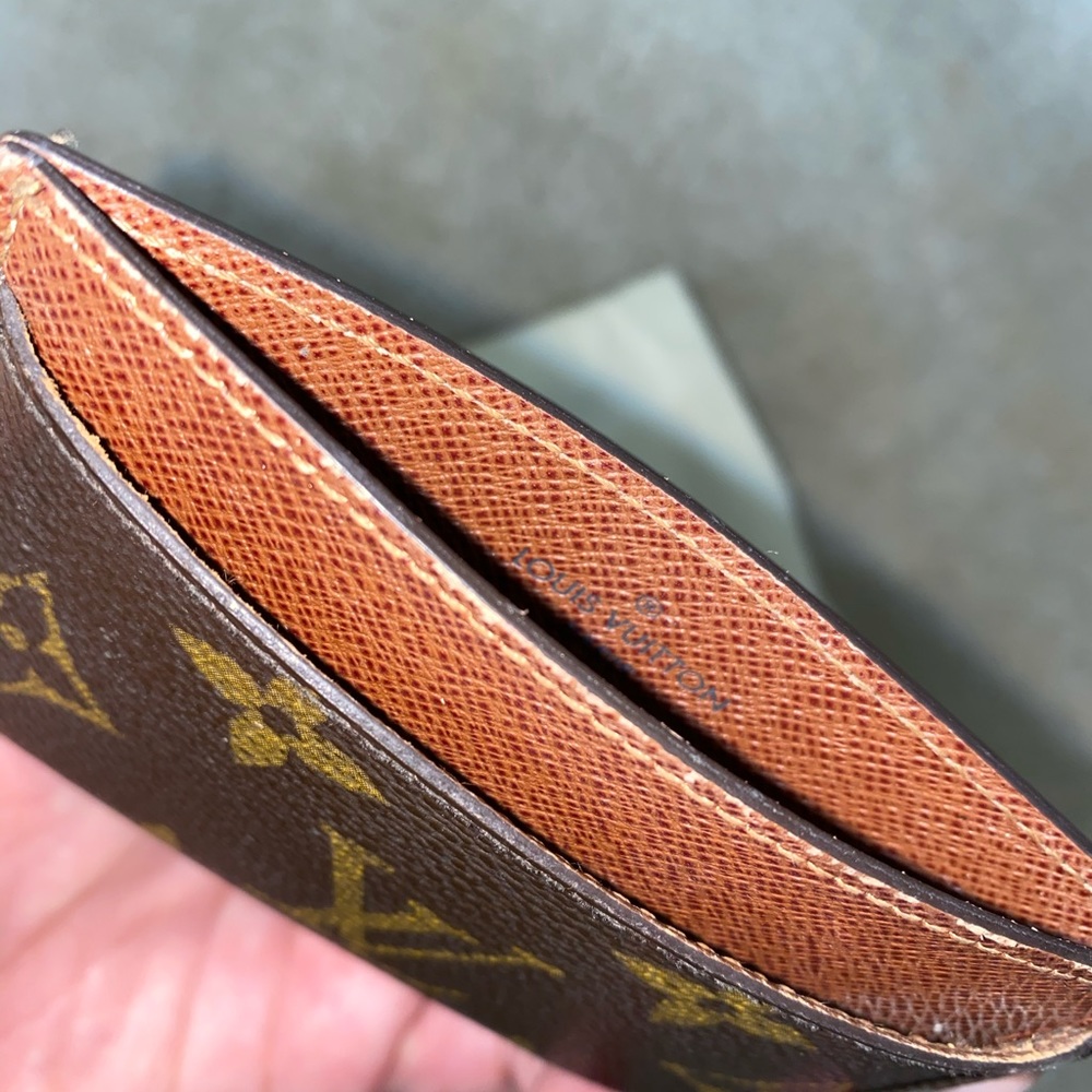 Credit card holder with dust bag and box.